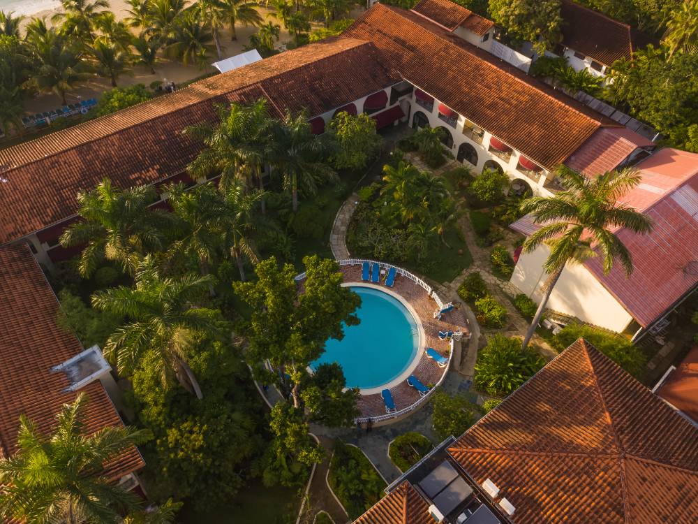 Named the best beachfront hotel by Luxury Travel Guide in 2020 Charela Inn has some IG-worthy spots like their hacienda style pool - Photo by Sheldon Levene