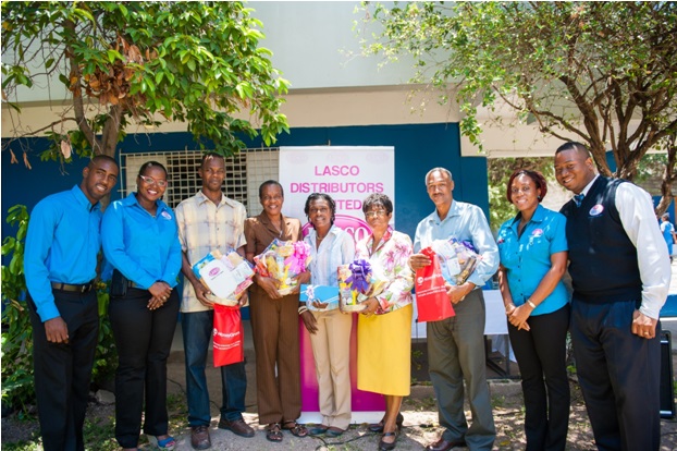 Members of the Merl Grove High School academic staff were feted by LASCO Financial Services at a Pre-Teachers’ Day treat on Monday, May 4. (L-r)  Jean-Pierre Robinson, Business Development Officer of LASCO Financial Services, Nicolene Worthy-Donaldson – Marketing Manager, LASCO Financial Services, Paul Faulknor, Carol Alexander, Principal, Tashaneia Austin, Joy Douglas-Smith, Vice-Principal, Beresford Sweeney, Renee Rose, Brand Manager, LASCO Distributors Limited, Matthew Blake, Marketing Officer, LASCO Financial Services. The teachers received goodies including gift baskets and a gift certificate for Adam and Eve Day Spa. Over 10 teachers from three schools received an early treat from LASCO Financial Services in preparation for Teachers’ Day on May 6.