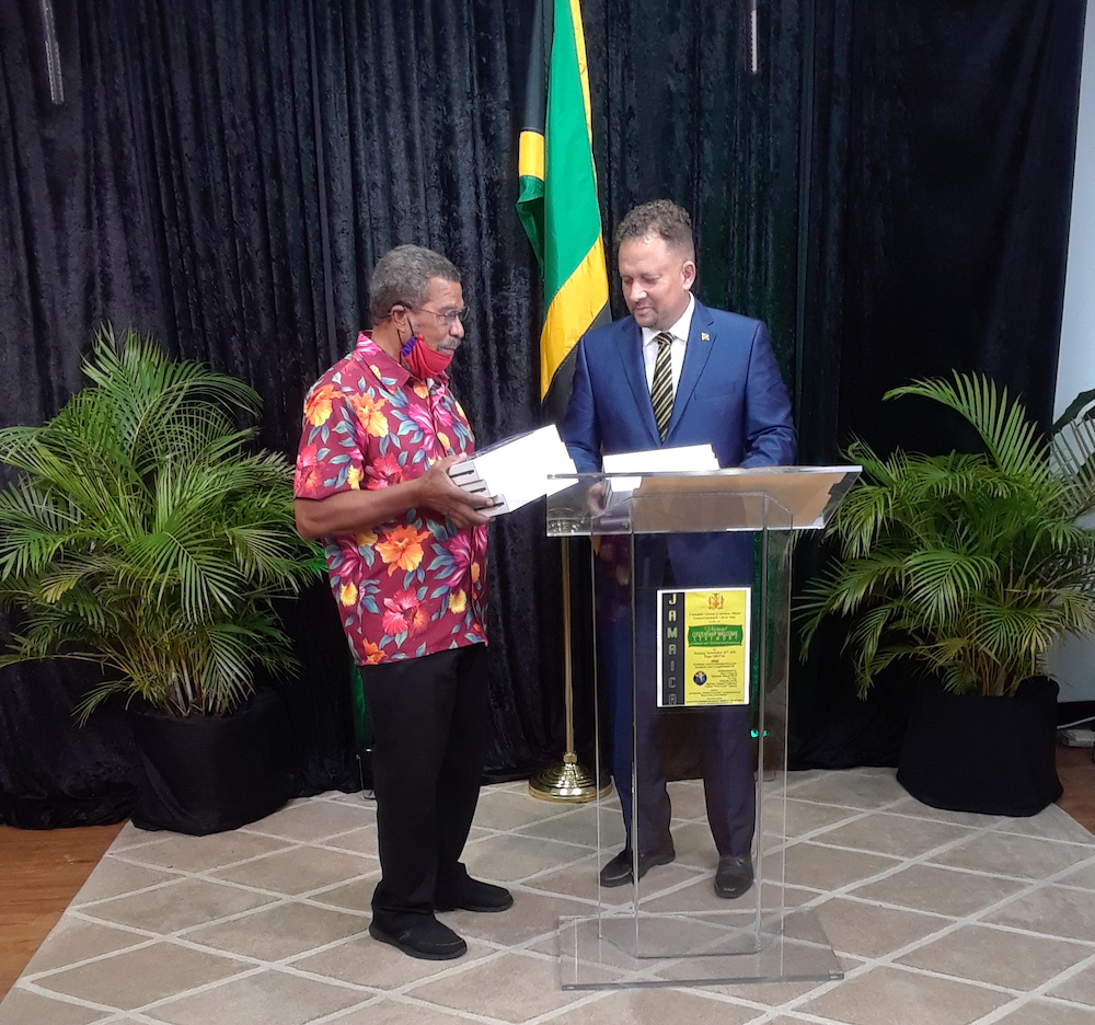 CG Mair (right)  accepting a contribution of tablets from President of the Louise Bennett Coverley Heritage Council (FLA), Inc., Colin Smith (left) as donation to the Edna Manley College, Kingston.  This is part of the drive to equip educational institutions in Jamaica with computer devices.